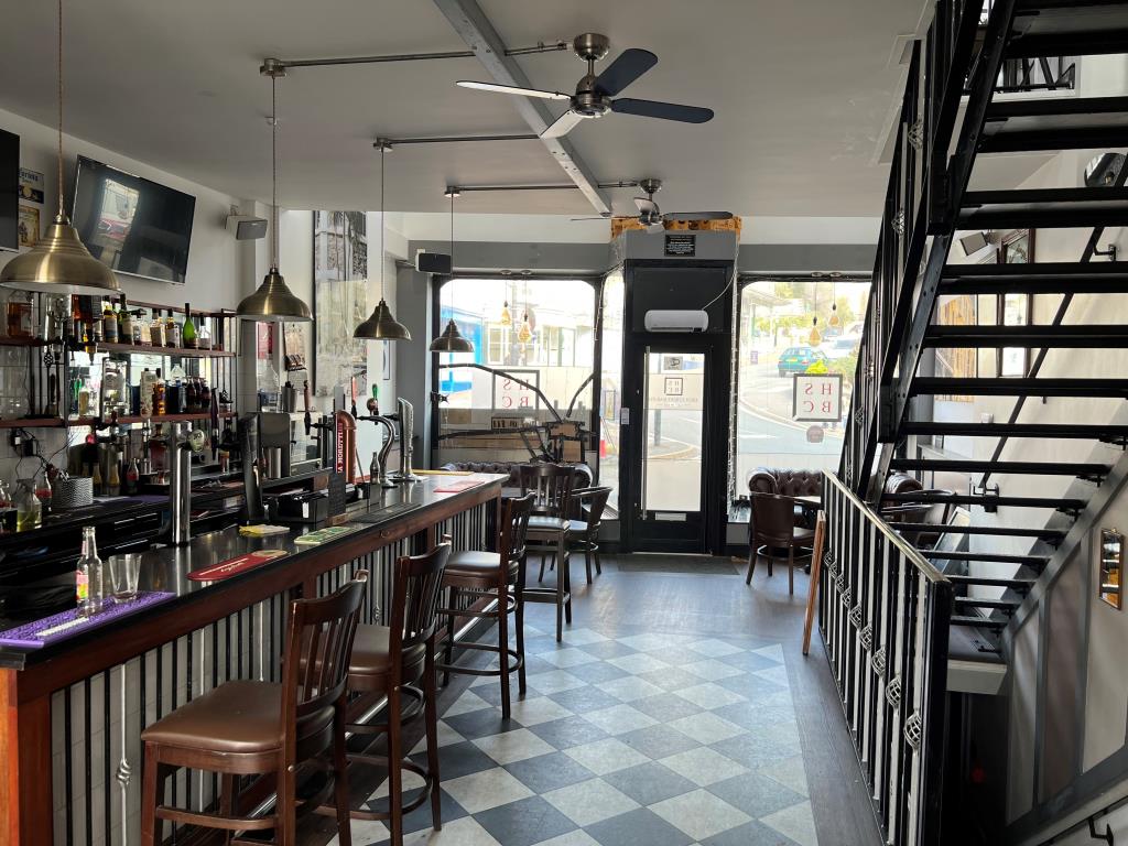 Lot: 79 - TOWN CENTRE FREEHOLD THREE STOREY BAR WITH GARDEN AND PARKING - The main bar looking towards the street